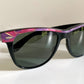 Ray Ban Sreet neat sunglasses with pink mosaice frame on a white surface