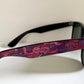 Ray Ban Sreet neat sunglasses with pink mosaice frame on a white surface