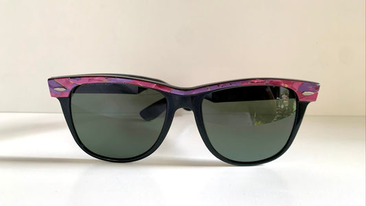 Ray Ban Sreet neat sunglasses with pink mosaice frame on a white surface