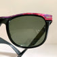 Ray Ban Sreet neat sunglasses with pink mosaice frame on a white surface