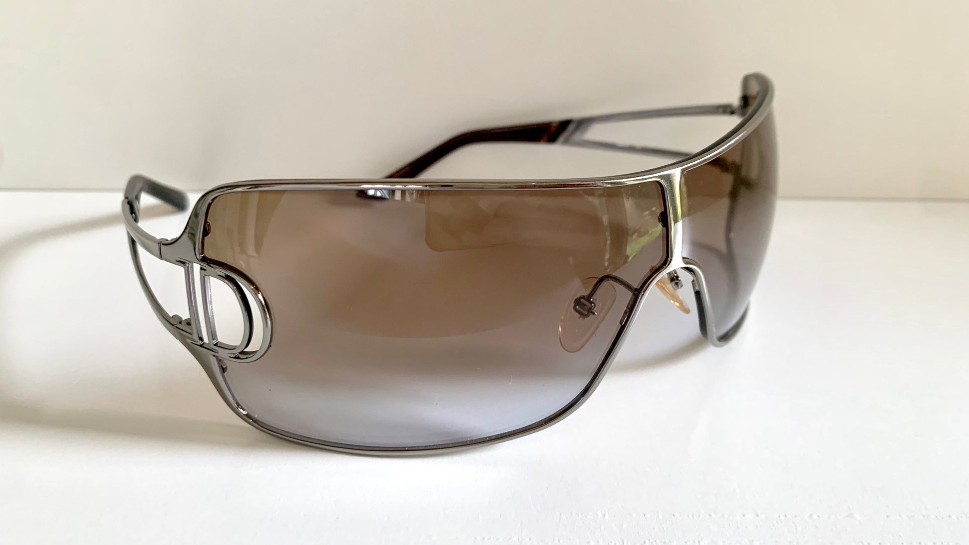 Christian Dior Diorissimo shield sunglasses on a white background