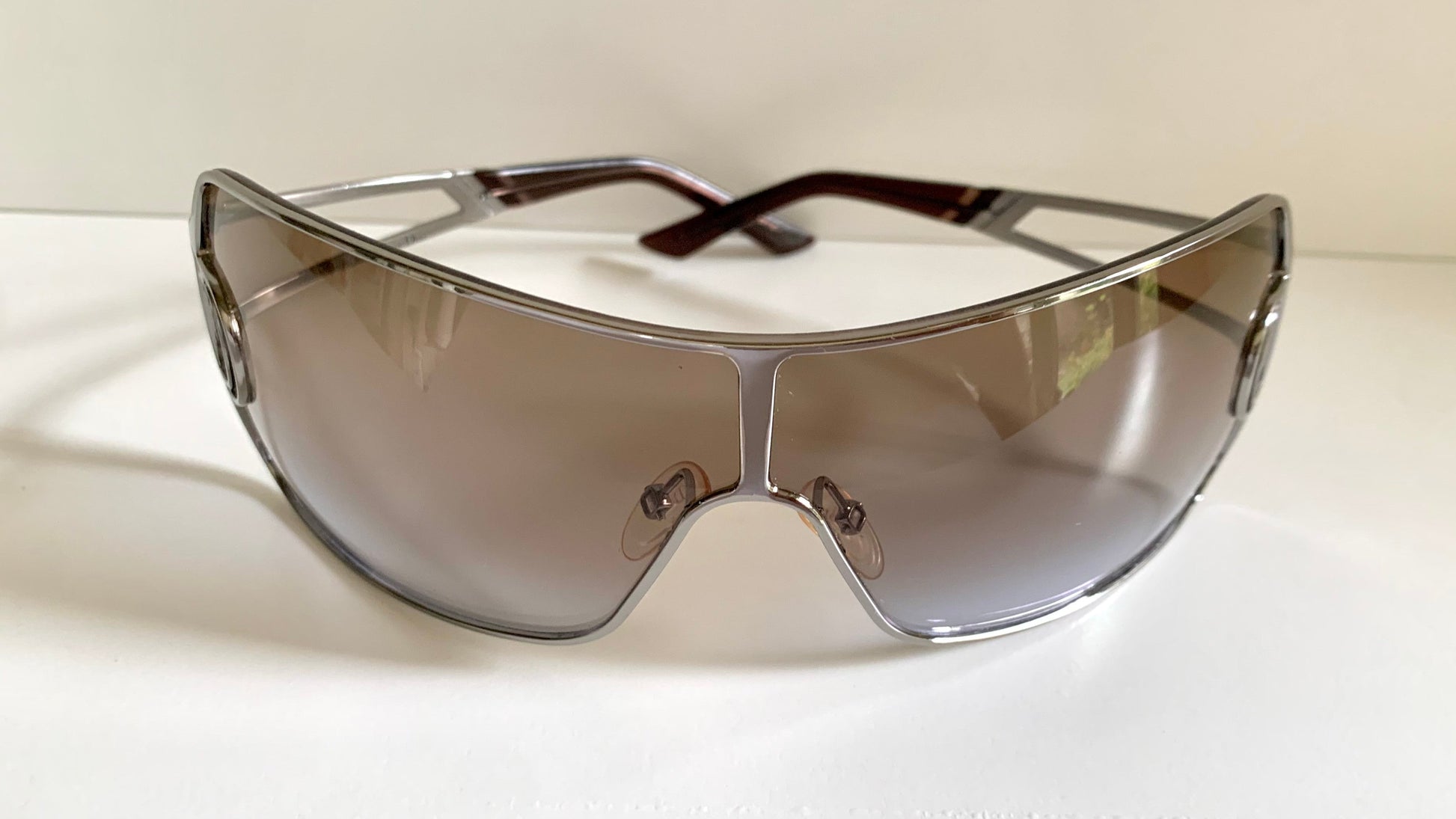Christian Dior Diorissimo shield sunglasses on a white background
