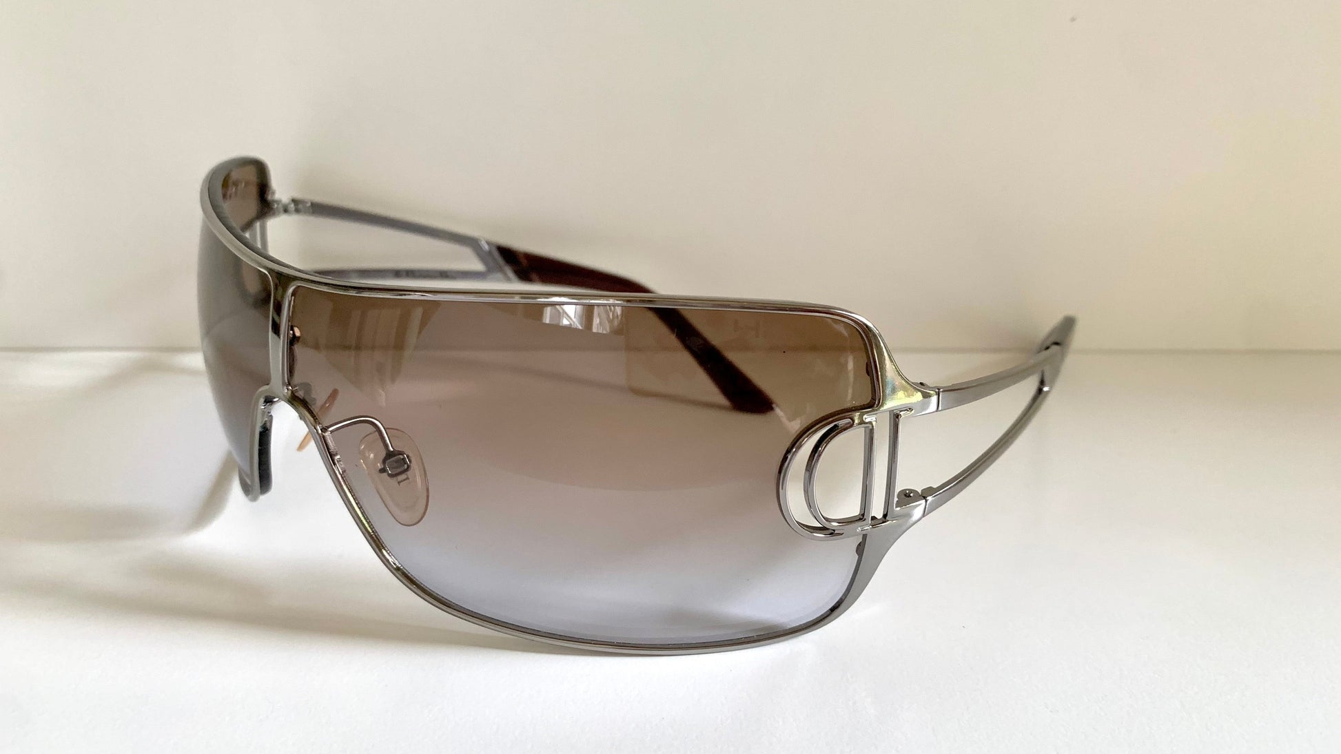 Christian Dior Diorissimo shield sunglasses on a white background