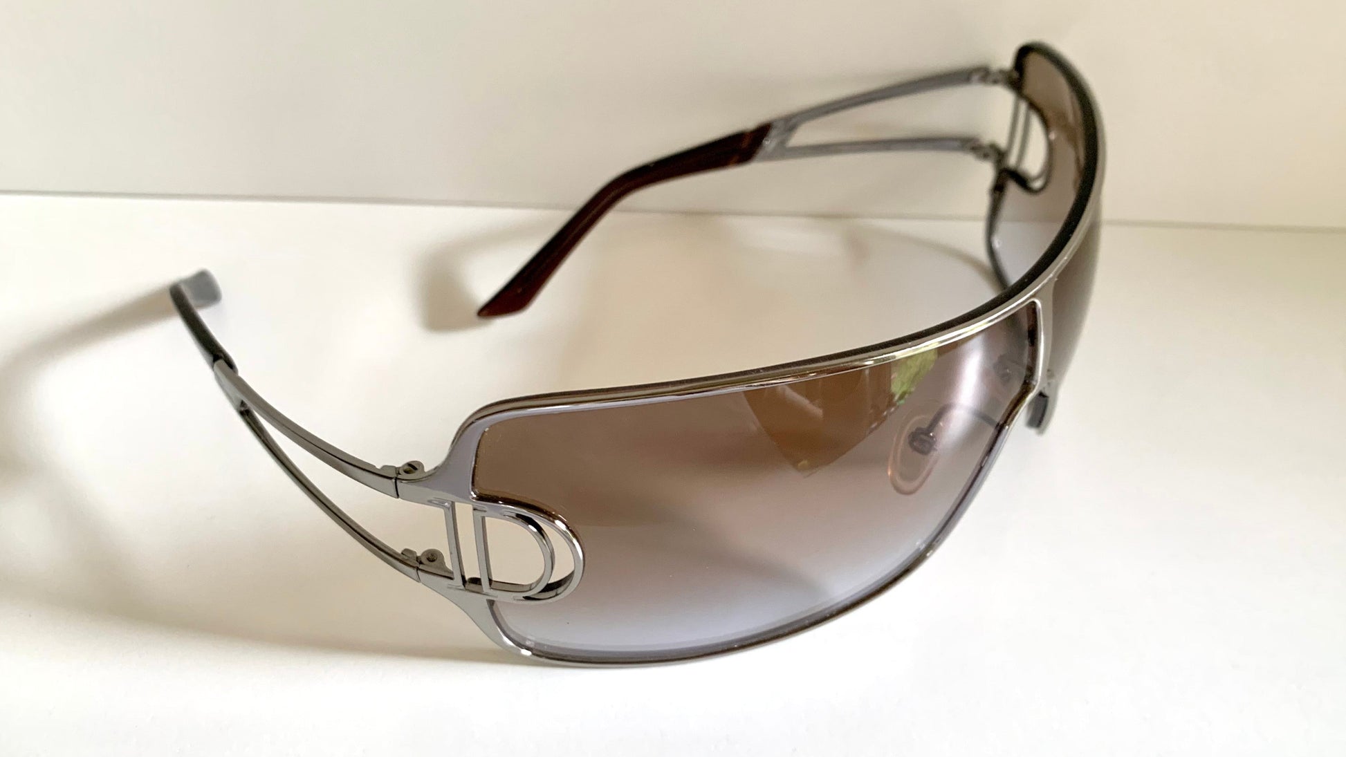 Christian Dior Diorissimo shield sunglasses on a white background