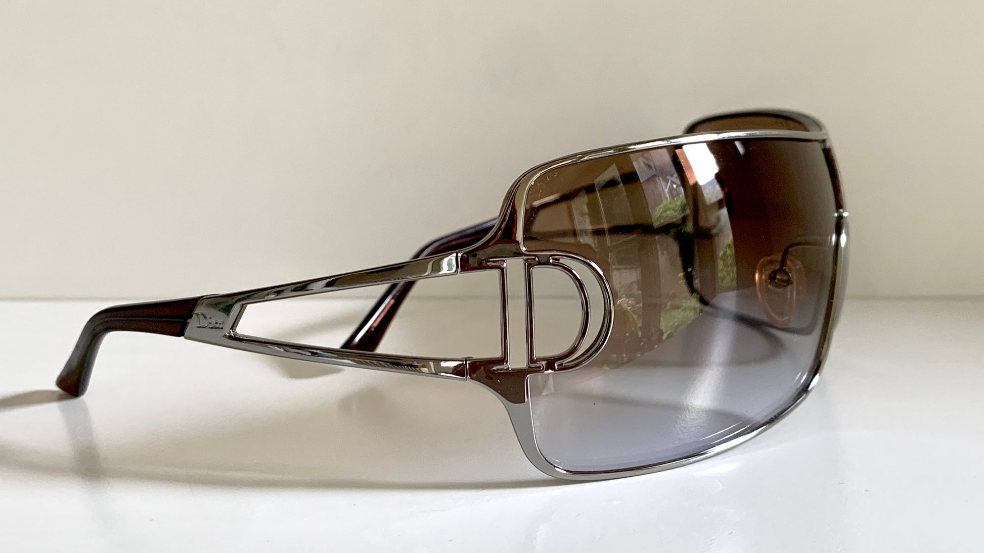 Christian Dior Diorissimo shield sunglasses on a white background