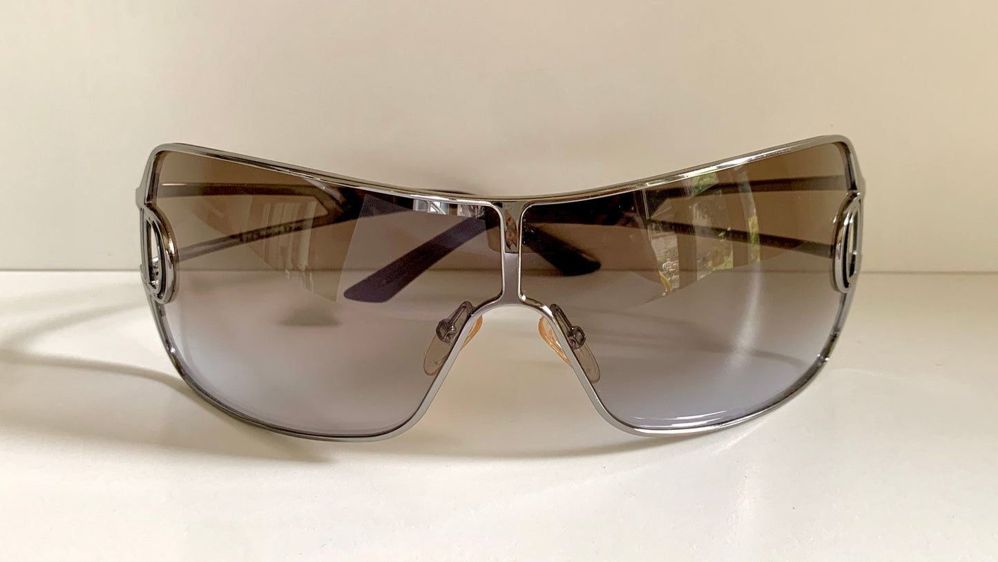 Christian Dior Diorissimo shield sunglasses on a white background
