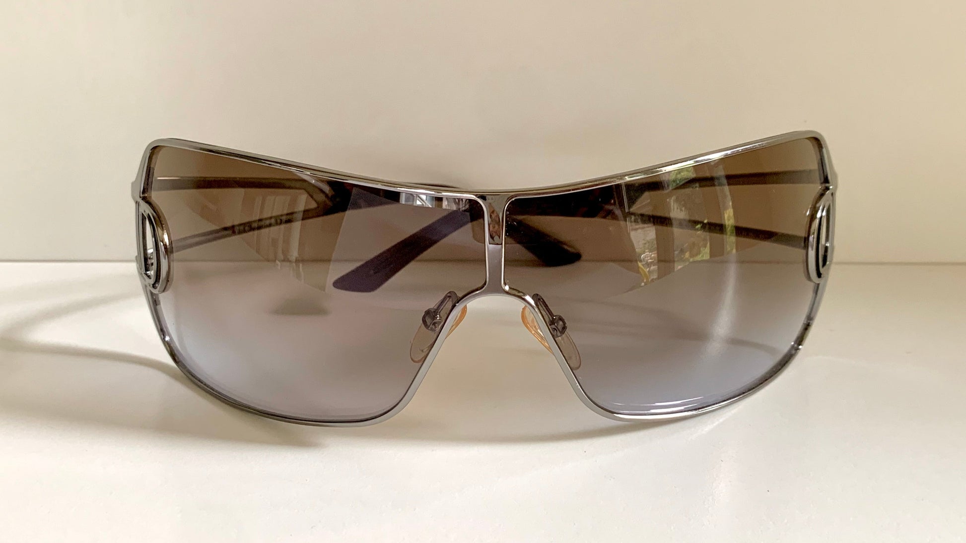 Christian Dior Diorissimo shield sunglasses on a white background