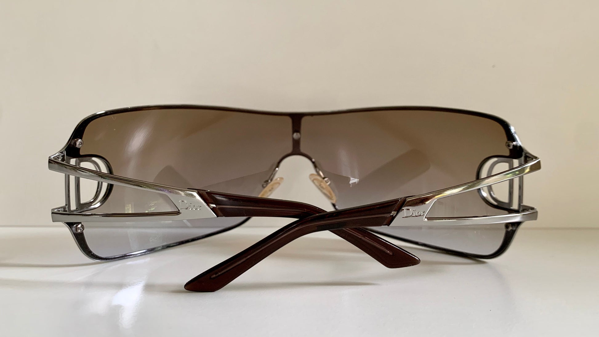 Christian Dior Diorissimo shield sunglasses on a white background