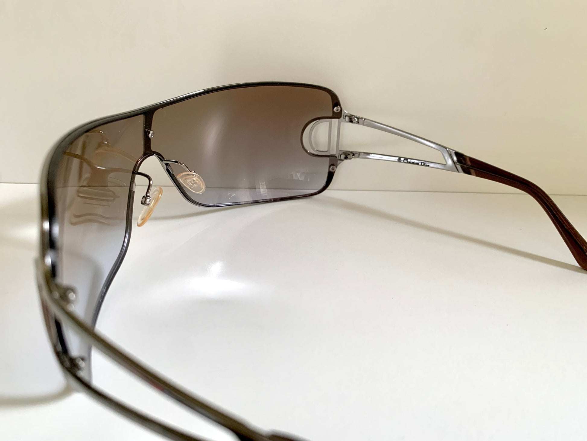 Christian Dior Diorissimo shield sunglasses on a white background
