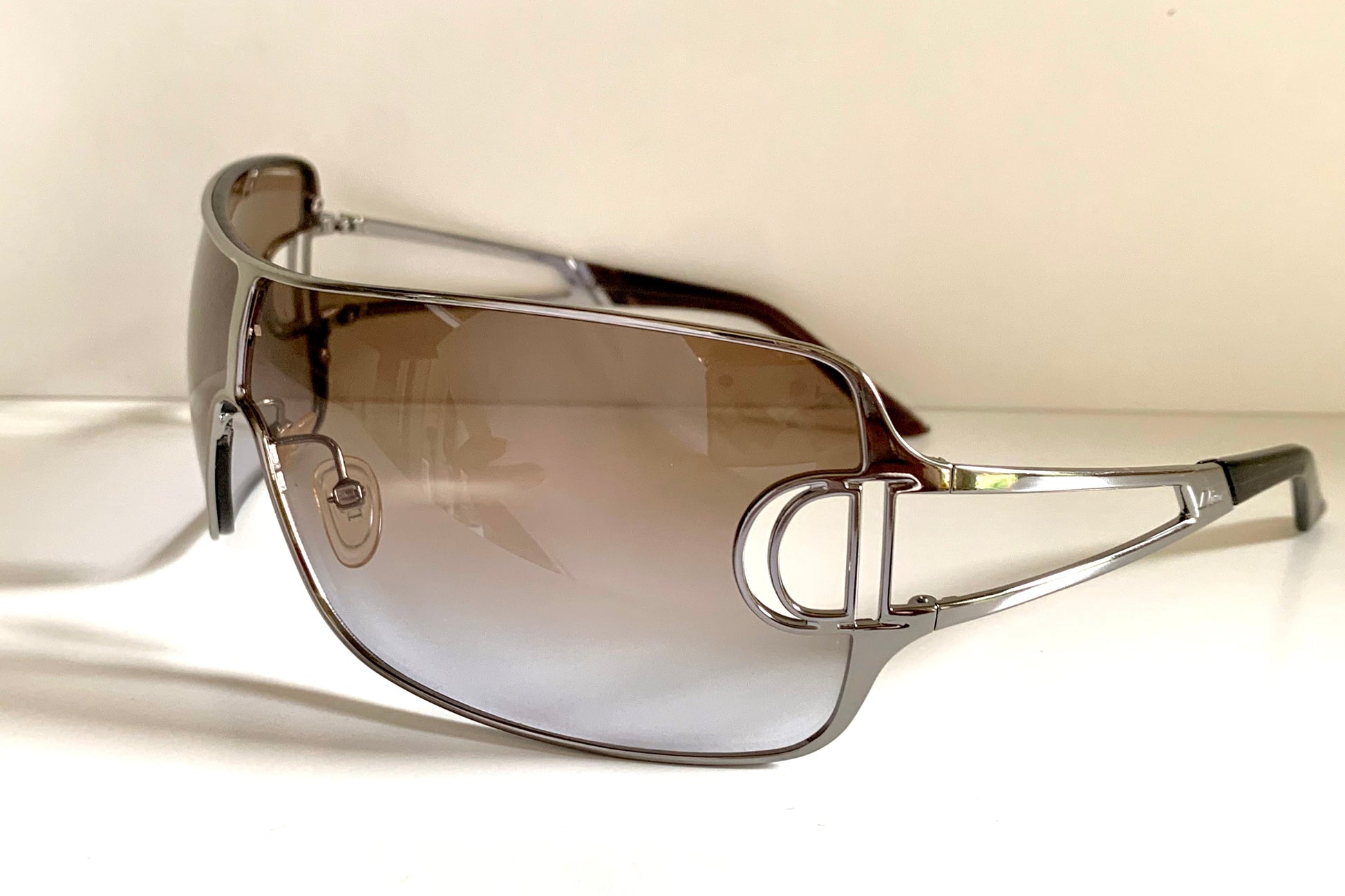 Christian Dior Diorissimo shield sunglasses on a white background