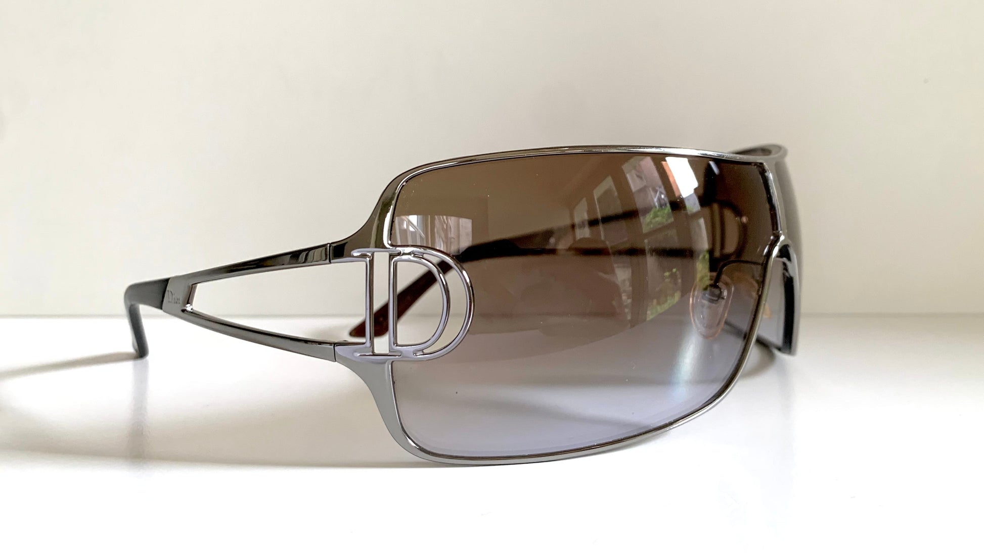 Christian Dior Diorissimo shield sunglasses on a white background
