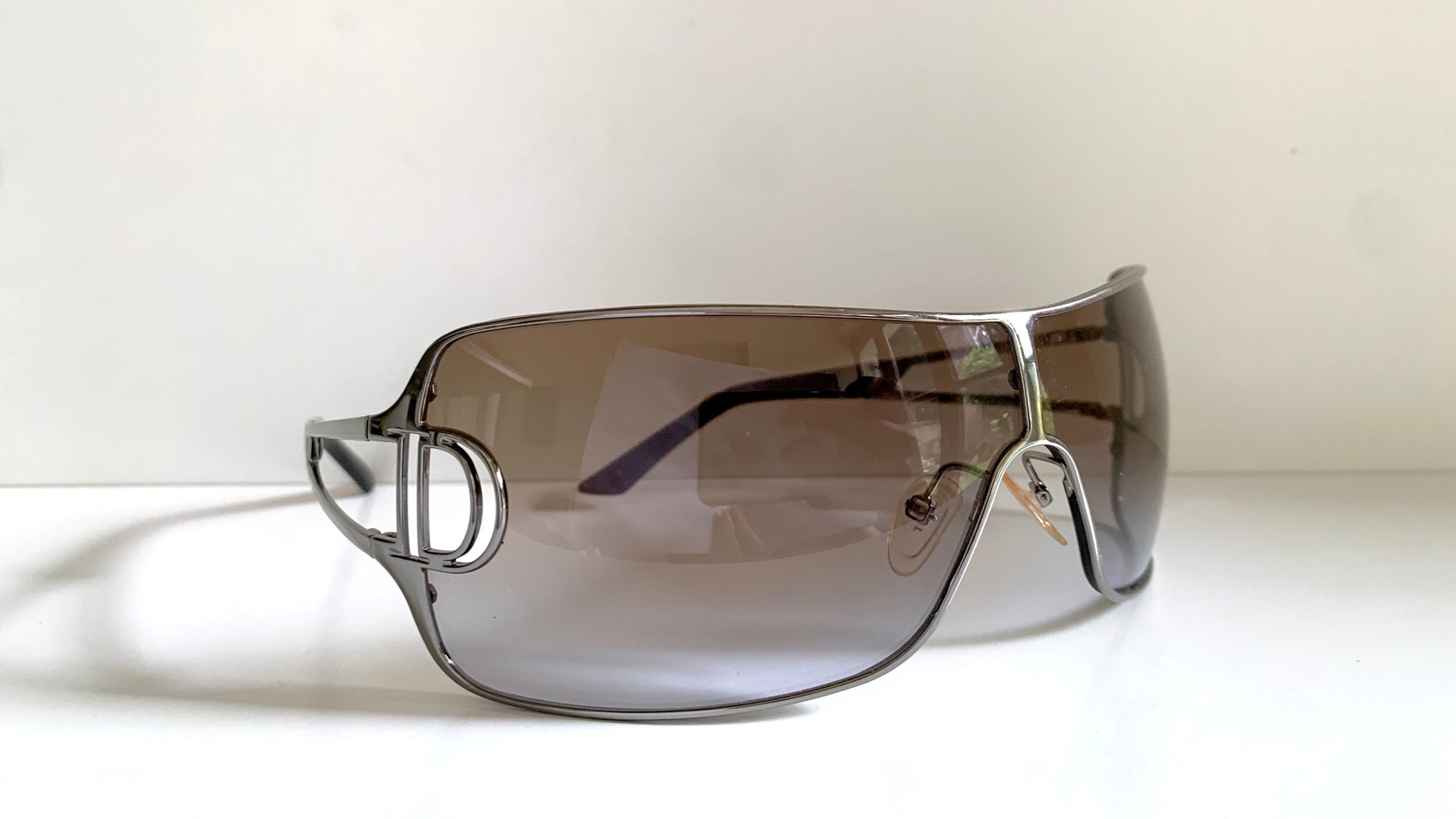Christian Dior Diorissimo shield sunglasses on a white background