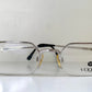 Silver Vogue eyeglasses on a white background
