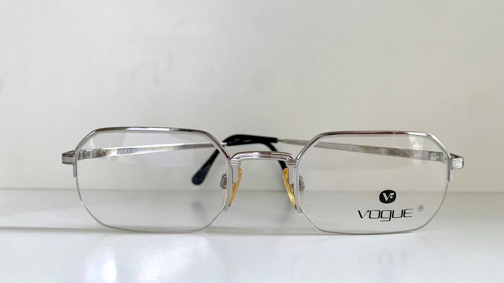 Silver Vogue eyeglasses on a white background