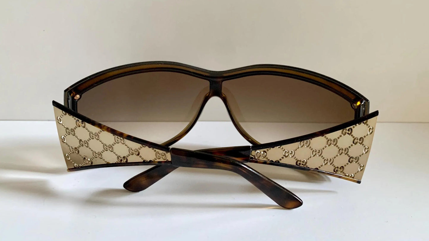 Gucci Vintage-Sonnenbrille aus den 90ern – brauner Wrap-Rahmen mit Strass-Horsebit-Logo