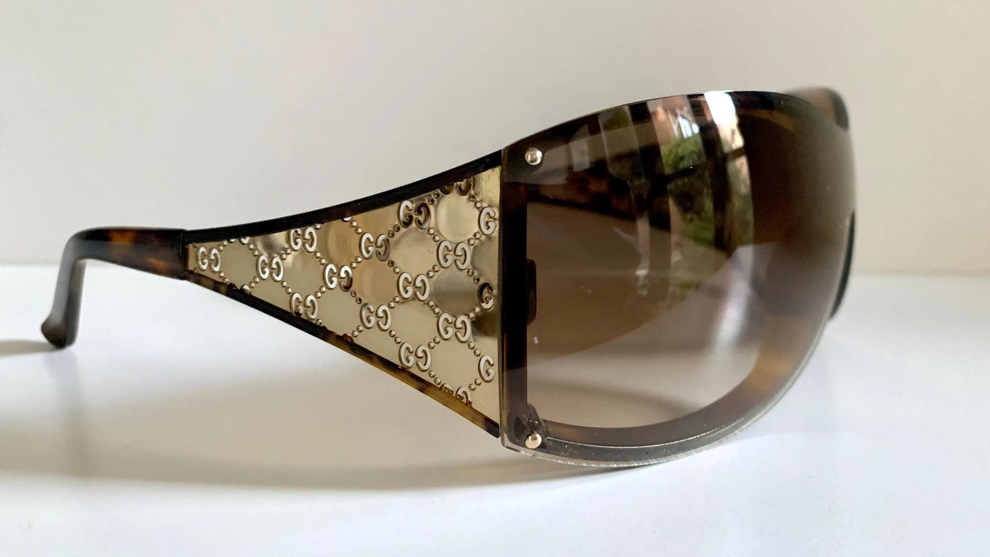 Gucci Vintage-Sonnenbrille aus den 90ern – brauner Wrap-Rahmen mit Strass-Horsebit-Logo