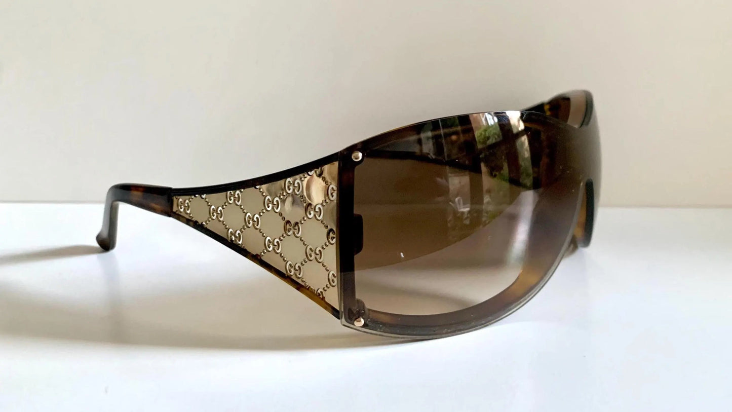 Gucci Vintage-Sonnenbrille aus den 90ern – brauner Wrap-Rahmen mit Strass-Horsebit-Logo